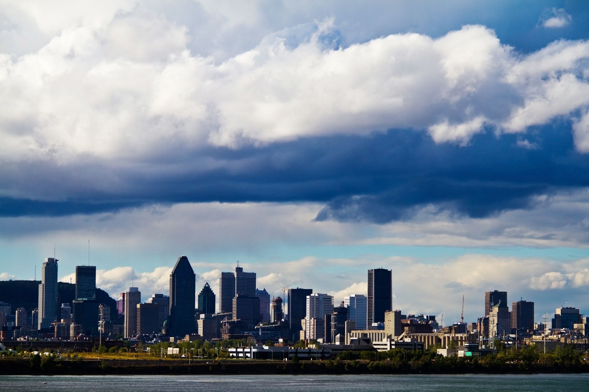 Dark storm clouds gathering over a city skyline, the brewing storm of scenario planning