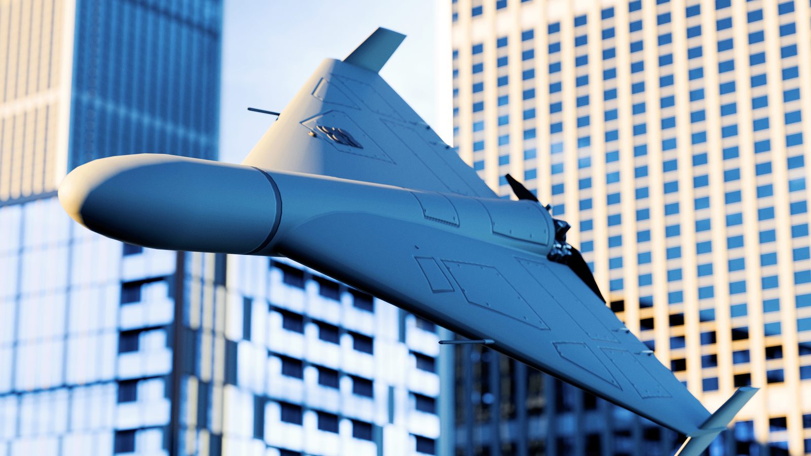 Delta-wing attack drone flying between city towers