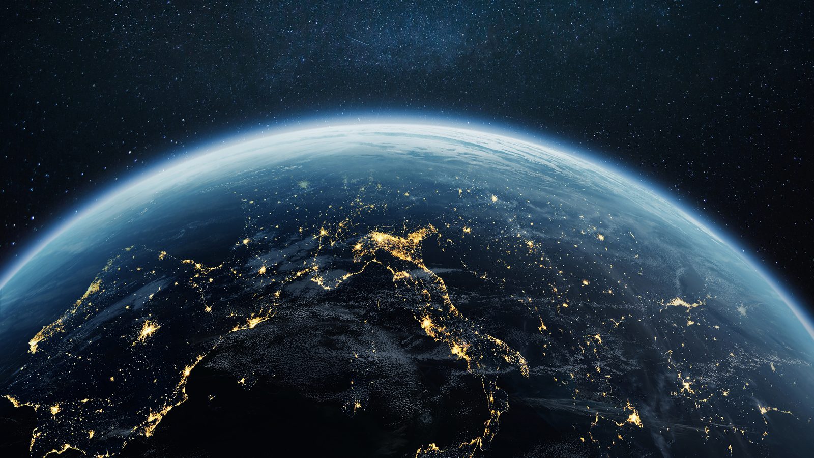 Earth at night from orbit, city lights tracing trade routes
