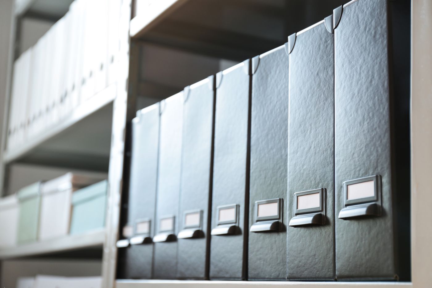 A row of black binders on a shelf, the fate of foresight reports nobody reads