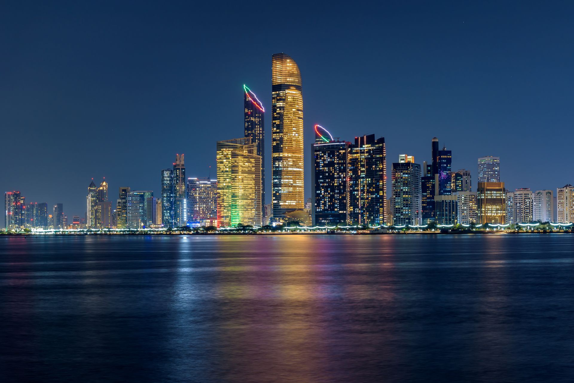 Abu Dhabi skyline at night, seat of Emirati intelligence