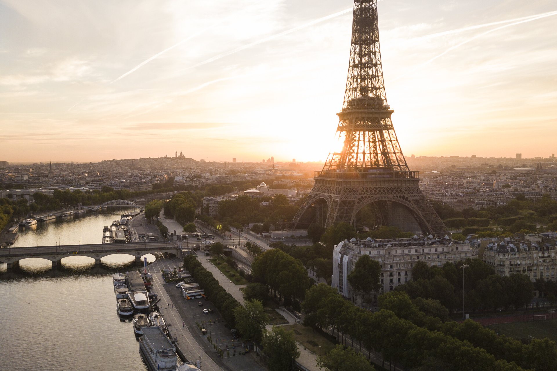 The Eiffel Tower and the Seine in Paris at sunset, the capital of French intelligence