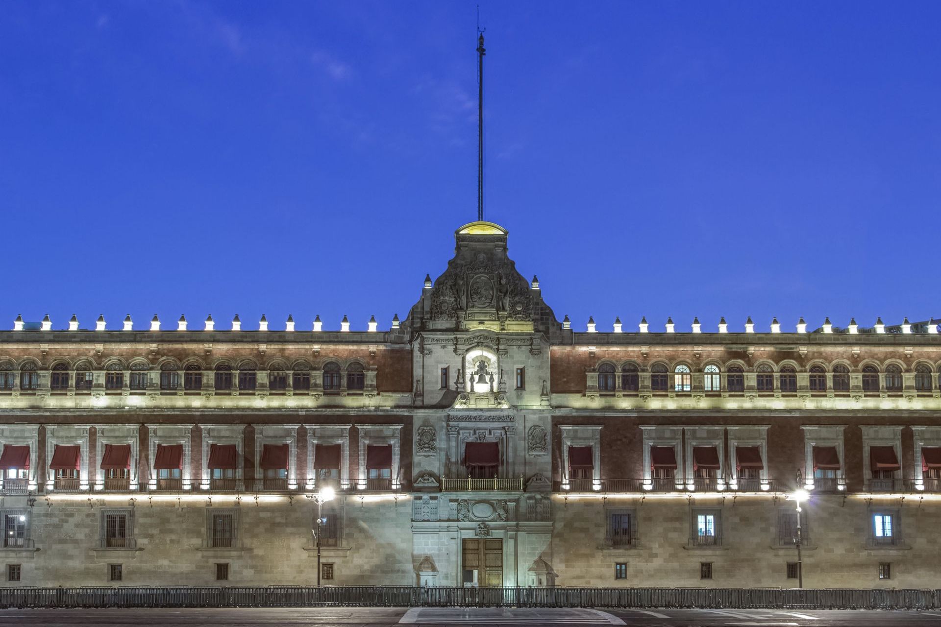 The National Palace in Mexico City at night, seat of the presidency that directs Mexican intelligence
