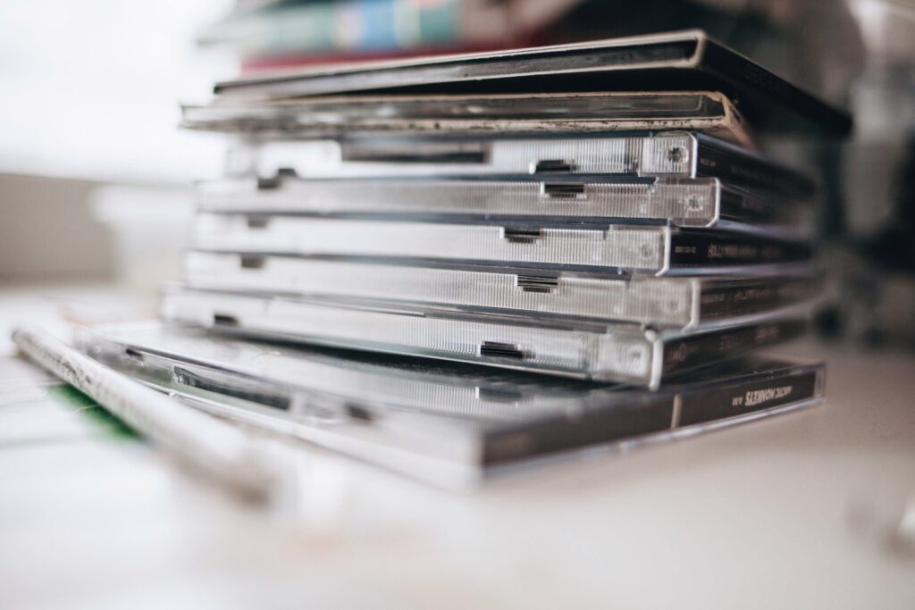 Stack of music CD cases, a reminder of how the record industry missed the trends that turned music into MP3 files
